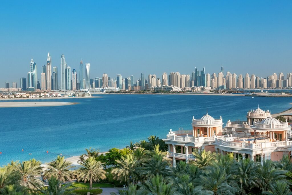 Dubai Marina skyline and Palm Jumeirah waterfront villas, luxury freehold property popular with GCC national buyers